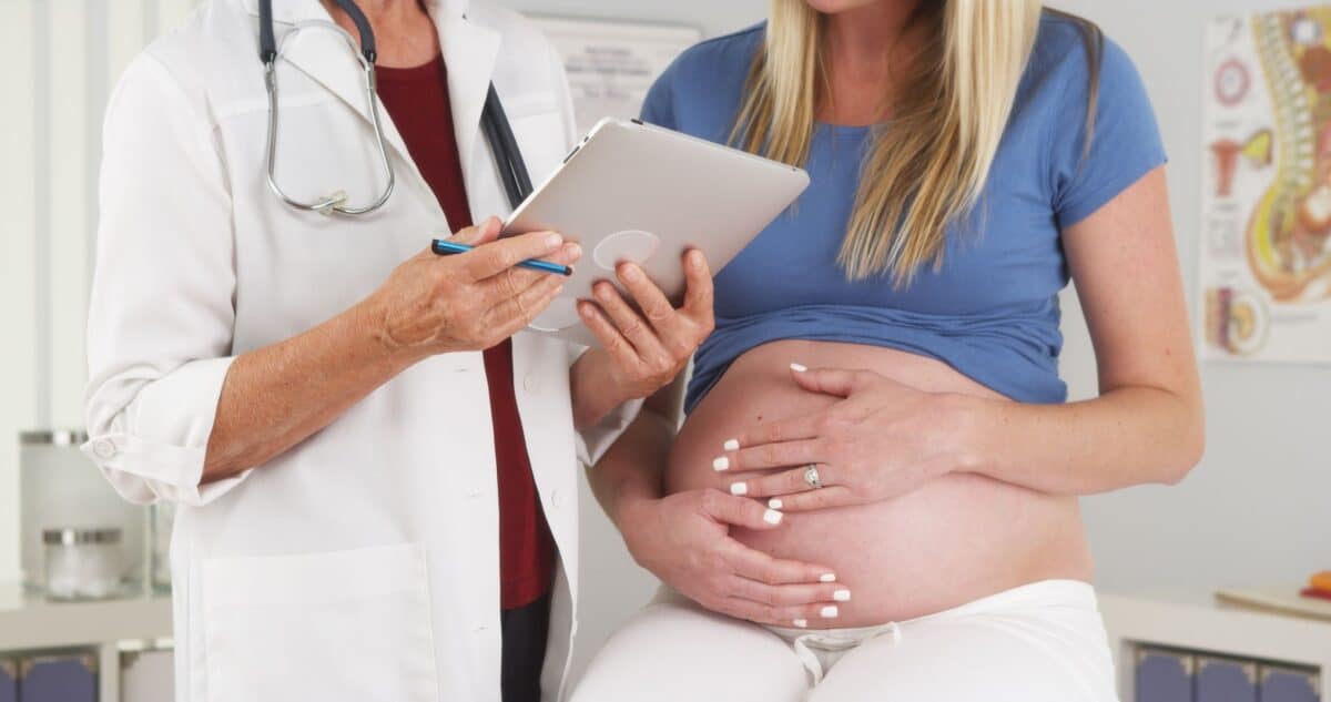 high risk pregnancy mom being monitored by her doctor.